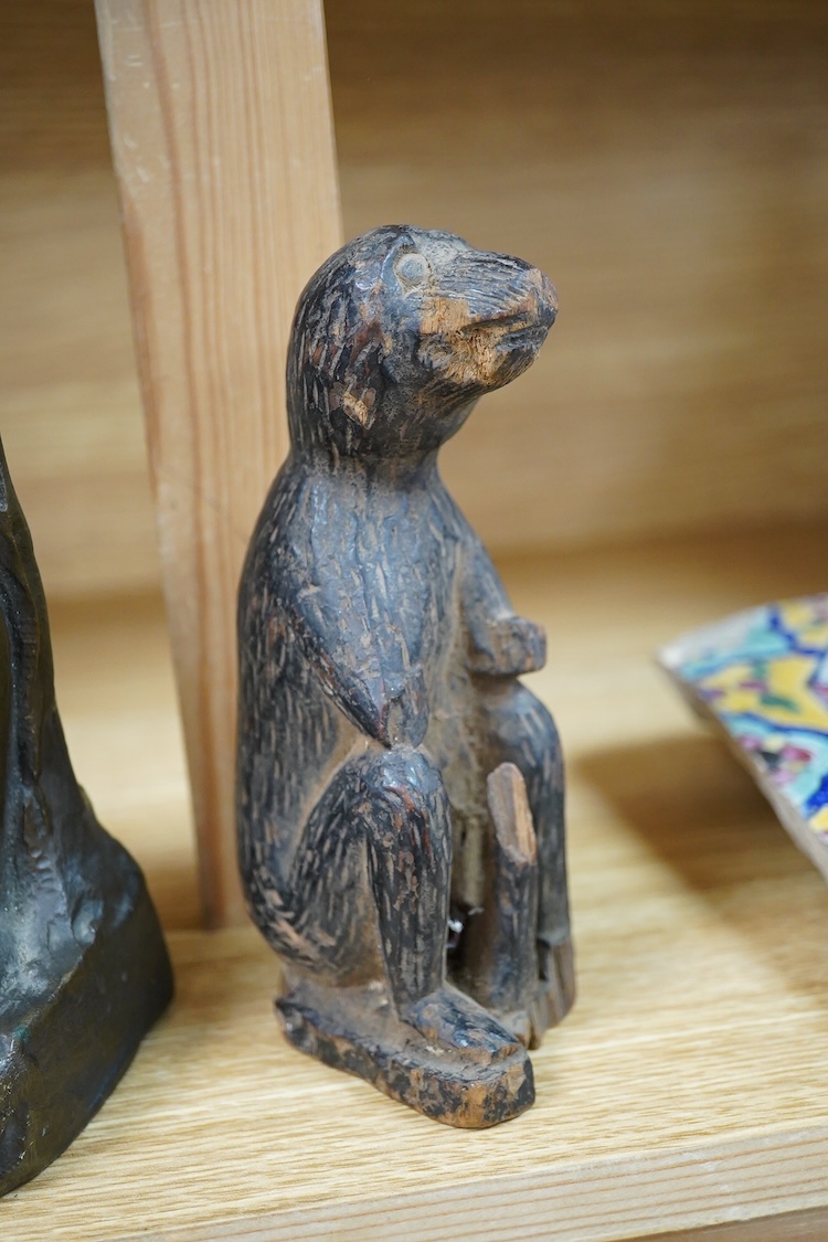 A contemporary bronze figure of a standing female nude, indistinctly signed and a card wood figure of a bear, tallest 29.5cm